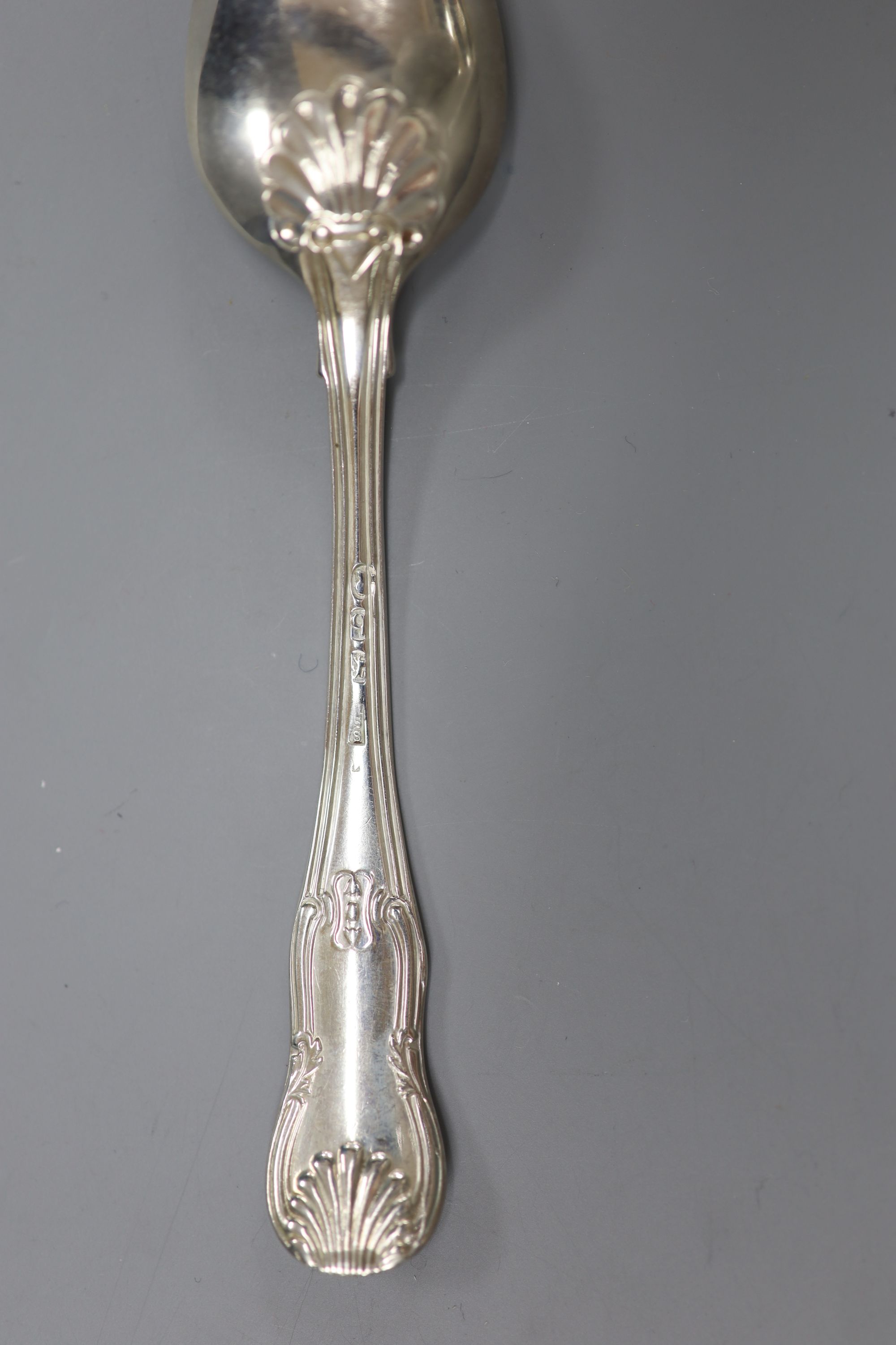 A matched set of twelve George III silver hourglass pattern teaspoons, various makers, London, 1817/8, 11oz.